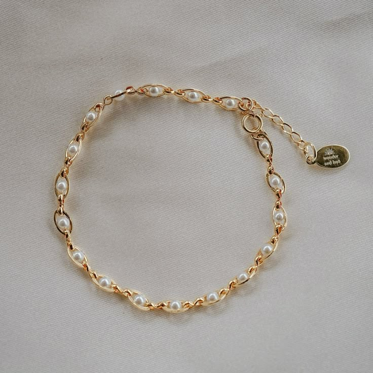 Our Pippa Pearl Bracelet is dainty + modern! What do we love about it? The tiny pearl accents add just a touch of traditional style in a modern way! This bracelet is perfect for any bridal event but can also be worn any time of the year or for any occasion which makes this the perfect gift! BRACELET FEATURES Materials: Brass, 14K Gold, Rhodium, Faux Pearl Finish: Choice of Yellow Gold or Rhodium Plating Dimensions: 6.5" with a 2" extender (can be worn up to 8.5") 14K gold-filled or sterling silv Pearl Bracelets, Gold Pearl Bracelet, Jewelry Accessories Ideas, Bohemian Necklace, Gold Bracelet Chain, Christian Jewelry, Bridal Bracelet, Yellow Gold Chain, Pearl Chain