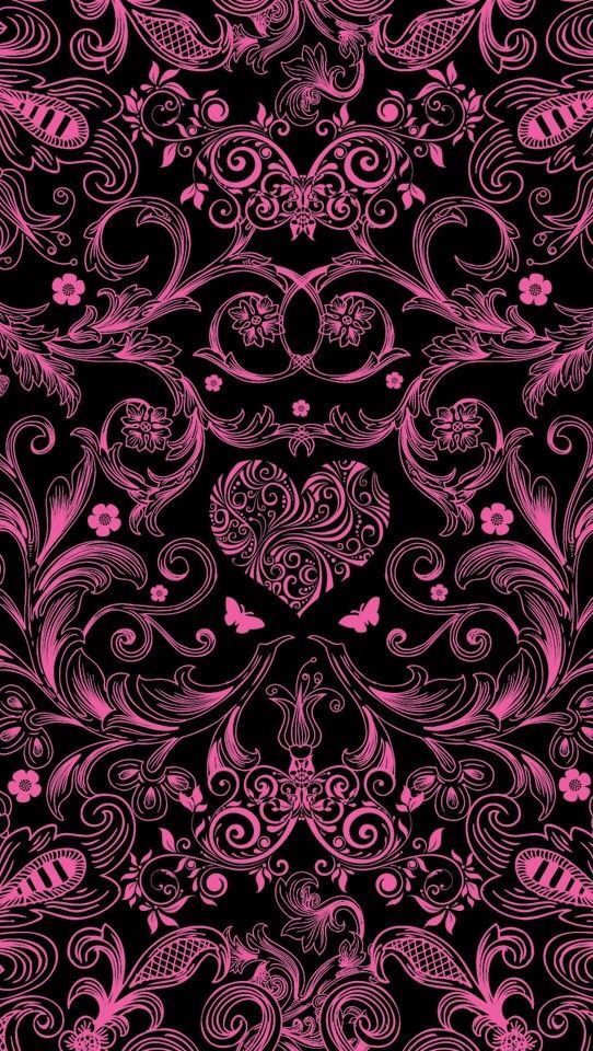 a black background with pink flowers and swirls