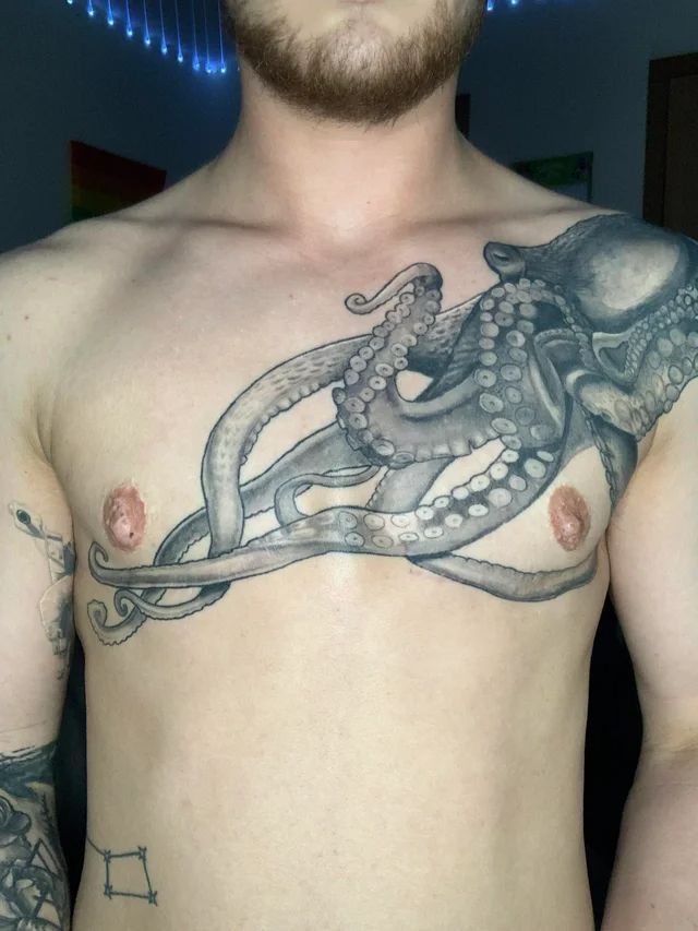 a man with an octopus tattoo on his chest