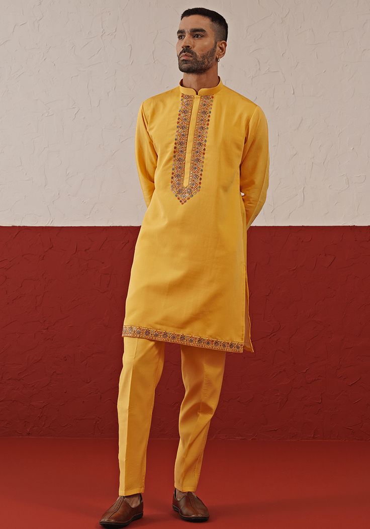 Step into sophistication with Yellow Embroidered Kurta. Crafted from georgette, the kurta features intricate resham and sequinned yoke embroidery. Perfect for Sangeet, Mehendi, or Haldi ceremonies. Composition : Kurta & Trouser : Viscose Georgette Care: Dry Clean Only and Vacuum Storage This product can be customized for sleeves, length and colour Delivery : 2-4 weeks as the product is hand crafted. Check Size Guide or choose MySize for free customisation (All Sizes above XL can be made at 15% a Cotton Silk Bandhgala With Resham Embroidery, Festive Cotton Silk Bandhgala With Resham Embroidery, Ceremonial Cotton Silk Sherwani With Resham Embroidery, Yellow Chanderi Sherwani Straight Kurta, Chanderi Sherwani With Resham Embroidery, Sherwani With Resham Embroidery In Chanderi Fabric, Festive Cotton Silk Sherwani With Embroidery, Bollywood Style Embroidered Cotton Silk Bandhgala, Ceremonial Cotton Silk Bandhgala With Zari Work