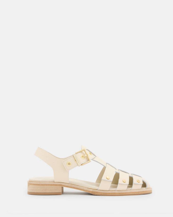 Nelly Studded Leather Sandals Parchment White | ALLSAINTS US Summer Sandals With Metal Pin Buckle And Flat Heel, Flat Sandals With Metal Pin Buckle For Summer, Leather Sandals With Metal Pin Buckle For Summer, Summer Leather Jelly Sandals With Buckle Closure, Summer Leather Jelly Sandals With Buckle, Closed Toe Sandals With Metal Pin Buckle For Summer, Summer Closed Toe Sandals With Metal Pin Buckle, Summer Sandals With Brass Buckle And Round Toe, Summer Beach Sandals With Brass Buckle