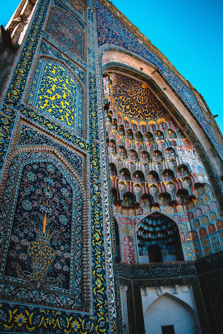 an intricately decorated building with blue sky in the background