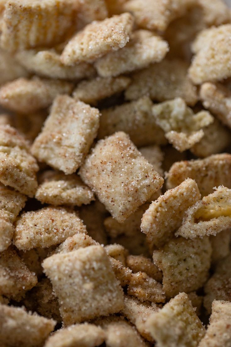 a pile of cereal that is sitting on a table with some kind of food in it