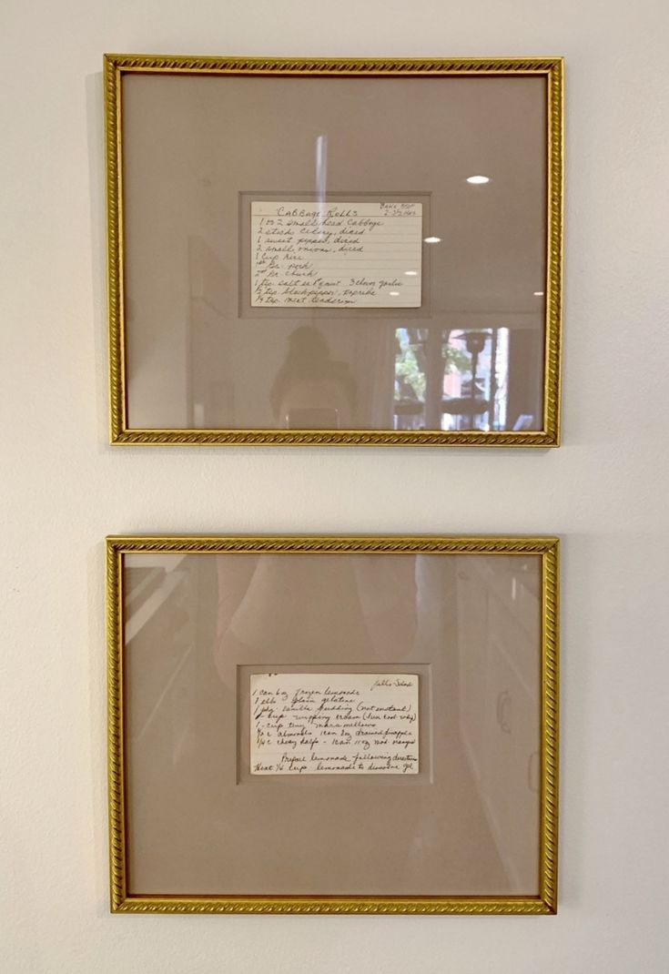 two framed photographs with writing on them