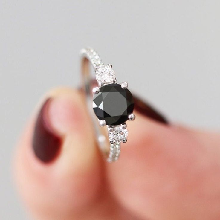 Black Round Diamond Ring, Black Engagement Ring, 1.85 Carat ,14k White Gold, Black And White Natural Diamonds, Black 3 Stone Multi Stone ring Unique Black Diamond Ring, Alternative Engagement Ring, Three diamonds ring Amazing black genuine diamond ring, with beautiful round-cut black diamond!  The Side white diamonds create contrast for the black and look just gorgeous.  An alternative engagement ring, or just an amazing gift for your loved one :) Setting Total Carat Weight: 1.85 14K White Gold Black Jewelry With Center Stone For Anniversary, Black Jewelry With Prong Setting For Anniversary, Black Round Band Fine Jewelry, Black Diamond Ring In Round Cut, Classic Black Sapphire Wedding Ring, Black Diamond Rings With Prong Setting, Black Diamond Rings With Round Cut, Black Diamond Jewelry With Prong Setting, Black Spinel Rings For Anniversary