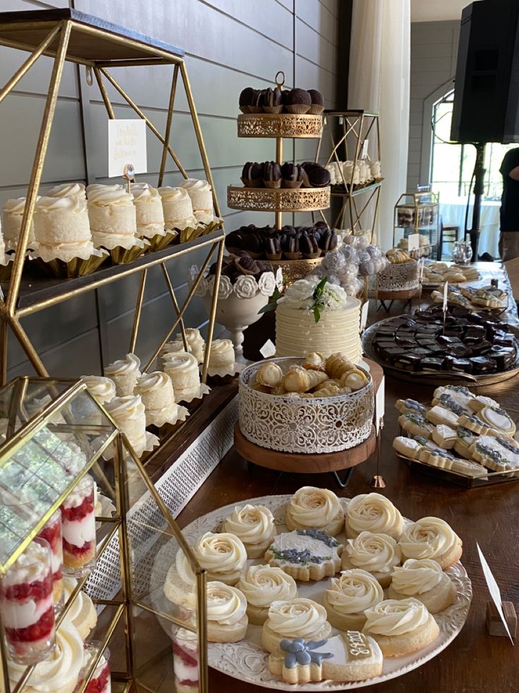 an assortment of desserts and pastries on display