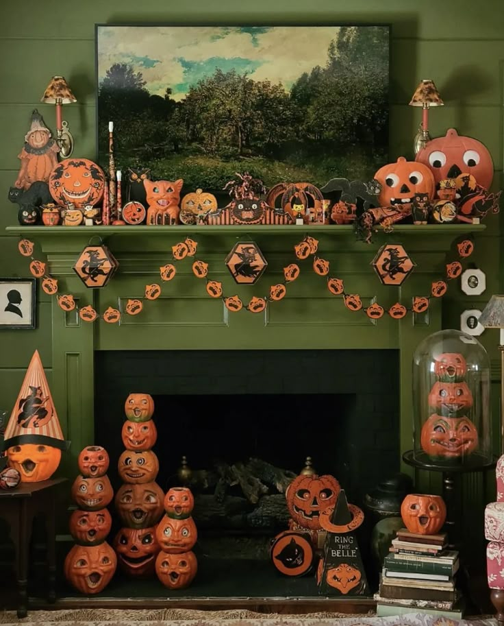 a fireplace decorated for halloween with pumpkins and decorations