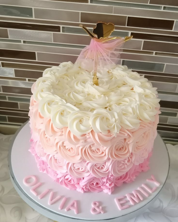 a cake with pink and white frosting on it