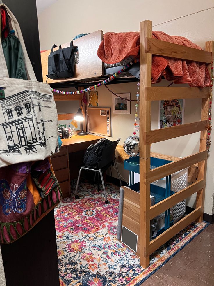 a bunk bed with a desk and chair in a room that has a rug on the floor