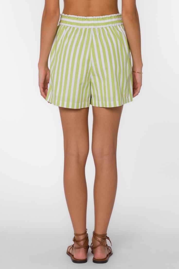 Get your summer style on with Kalyssa Shorts! These breezy striped shorts are perfect for any casual outing. The pull-on design makes them easy to wear, while the fun and playful stripes add a touch of whimsy to your wardrobe. Material: 100% Cotton Machine wash cold Color: Dark Citron White Stripe Model is 5'9"and wearing a size S Imported Spring Beach Shorts, Green Bottoms For Summer Outings And Beach Season, Casual Green Pajama Shorts For Spring, Spring Beach Bottoms With Short Legs, Green Beachwear Bottoms For Summer Outings, Green Shorts For Summer Outings And Beach Season, Green Summer Pajama Shorts With Elastic Waistband, Trendy Bottoms With Vertical Stripes For Day Out, Green Casual Pajama Shorts For Summer