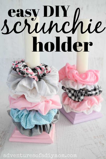 two candles are sitting on top of each other with the words easy diy scrunchie holder