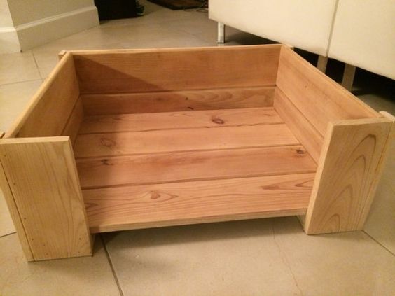 a wooden bench sitting on top of a tile floor