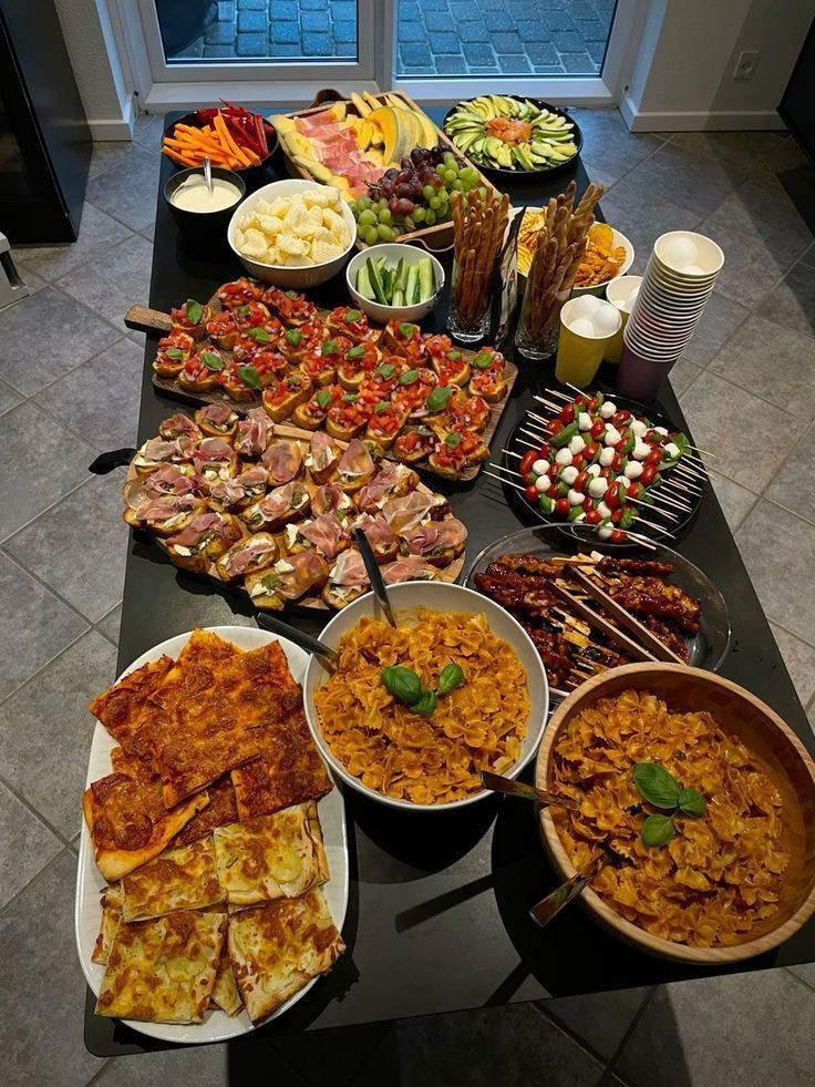 a buffet table filled with different types of food