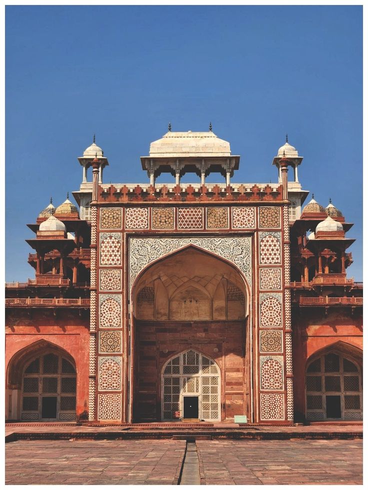 an ornate building with many windows and arches