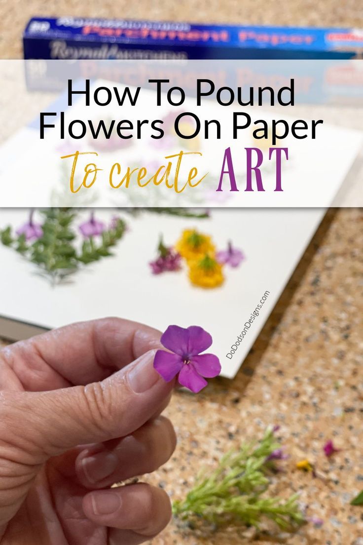 a person holding a flower in their hand with the text how to pound flowers on paper to create art