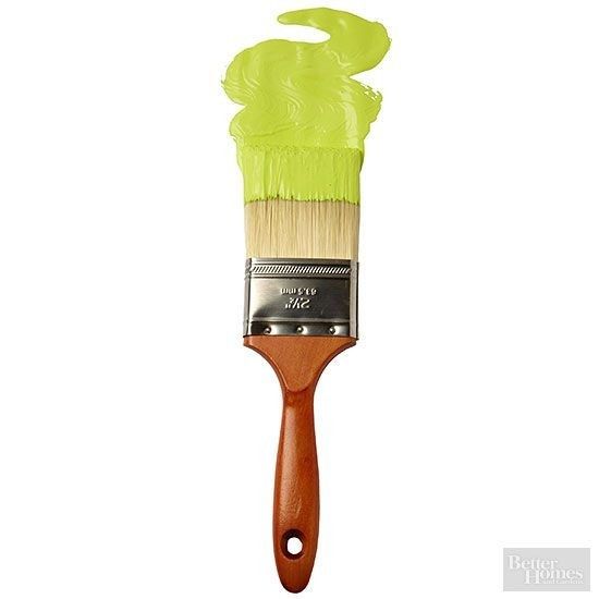 a paint brush with green bristles on it