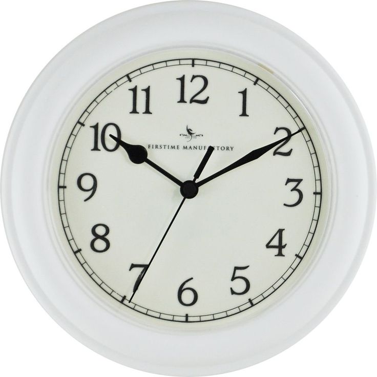 a white clock with black hands and numbers on the face is shown against a white background