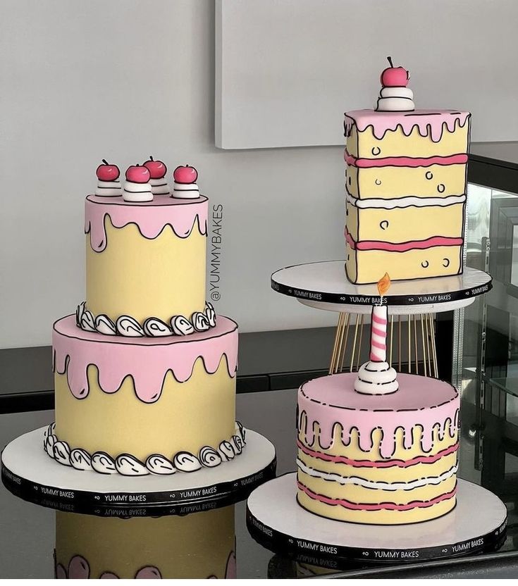 three tiered cakes sitting on top of each other in front of a glass table