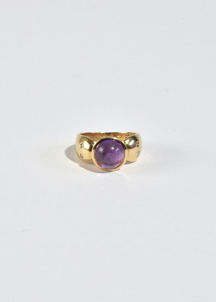 Stunning vintage gold ring with round amethyst cabochon and petite sapphire detail. Stamped 10k. Material: 10k gold, amethyst, sapphire. We recommend storing in a dry place and periodic polishing with a cloth. Opal Band Ring, Gold Topaz Ring, Vintage Gold Ring, Victorian Diamond Ring, Stone Sculptures, Stack Overflow, Moonstone Pendant Necklace, Green Tourmaline Ring, Vintage Gold Rings