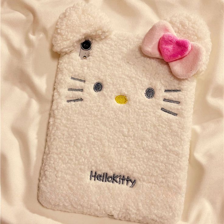 a hello kitty phone case with a pink bow on it