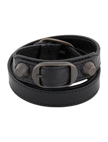 Women's black Balenciaga leather bracelet with tonal hardware and buckle closure. Unfortunately, due to restrictions, this item may not be eligible for shipping in all areas. Adjustable Black Leather Belt Bracelet, Edgy Leather Cuff Bracelet, Designer Leather Bracelet, Designer Leather Bracelets, Designer Adjustable Black Bracelets, Black Adjustable Designer Bracelets, Adjustable Leather Bracelet With Snap Closure, Designer Black Leather Strap Bracelets, Black Leather Bracelet With Palladium Hardware For Formal