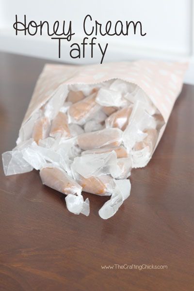 a paper bag filled with marshmallows sitting on top of a wooden table