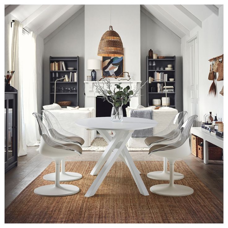 a white table and chairs in a room