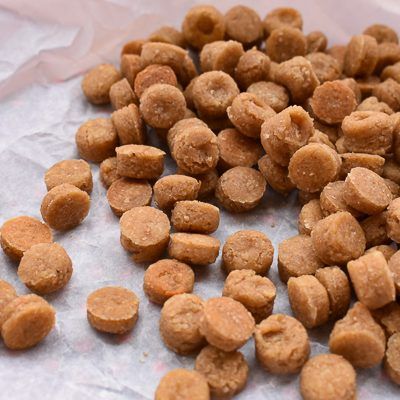 a pile of dog food sitting on top of a piece of paper