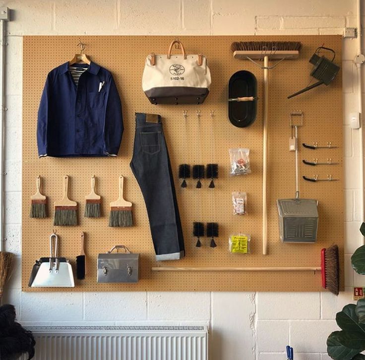 the wall is covered with various items and tools