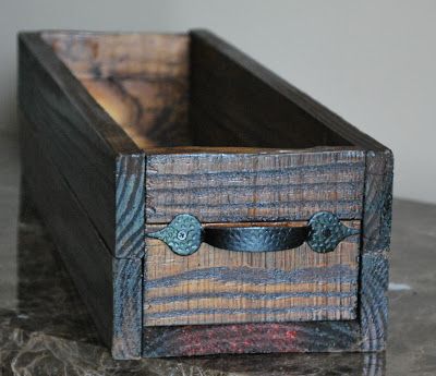 a wooden box sitting on top of a table