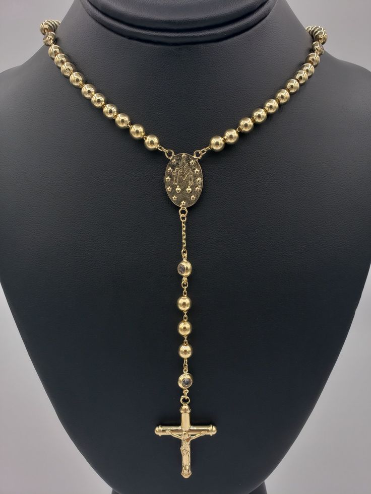 Handcrafted with precise detail, high quality, Rosary Chain. Available in a variety of widths and lengths- weight (grams) is provided once options are chosen. 100% 14K Gold. -Yellow Gold Rosary Chain -Length of the chain does not include the tail of the chain (For reference: Images are 6 millimeter, 24 inch, 14K Rosary Chain) Gold Crucifix Jewelry Stamped 14k, Yellow Gold Jewelry With Round Beads, Yellow Gold Rosary With Round Beads, Spiritual Yellow Gold Rosary With Round Beads, Elegant Gold Crucifix Jewelry, Elegant Yellow Gold Rosary With Crucifix, Yellow Gold Cross Rosary As Gift, Gold Crucifix Necklace In 14k Gold, Yellow Gold Cross Chain Jewelry