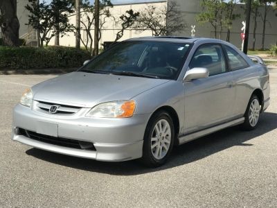 a silver car parked in a parking lot