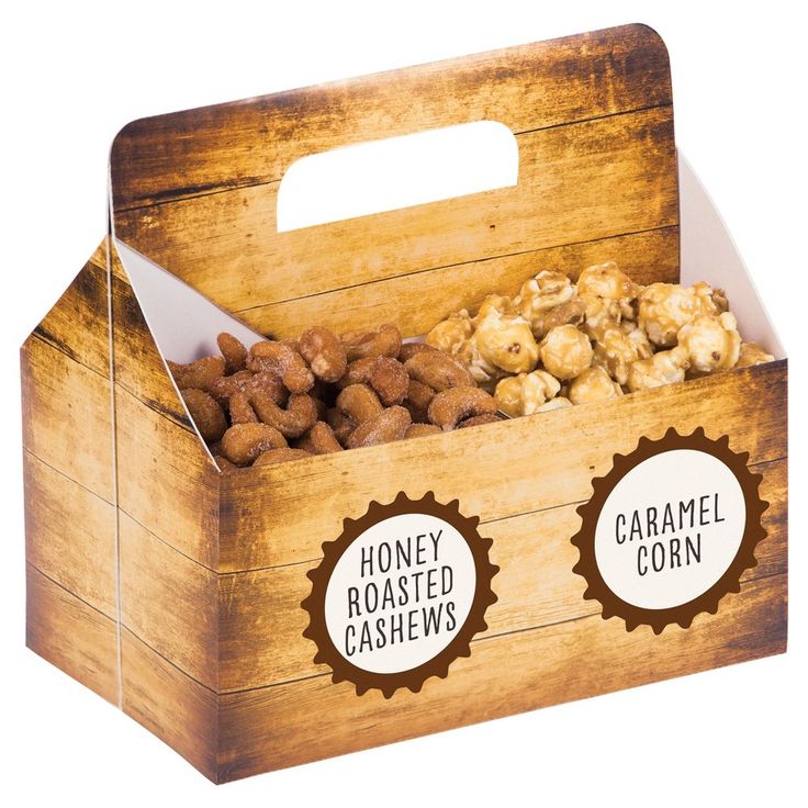 a wooden box filled with nuts sitting on top of a table