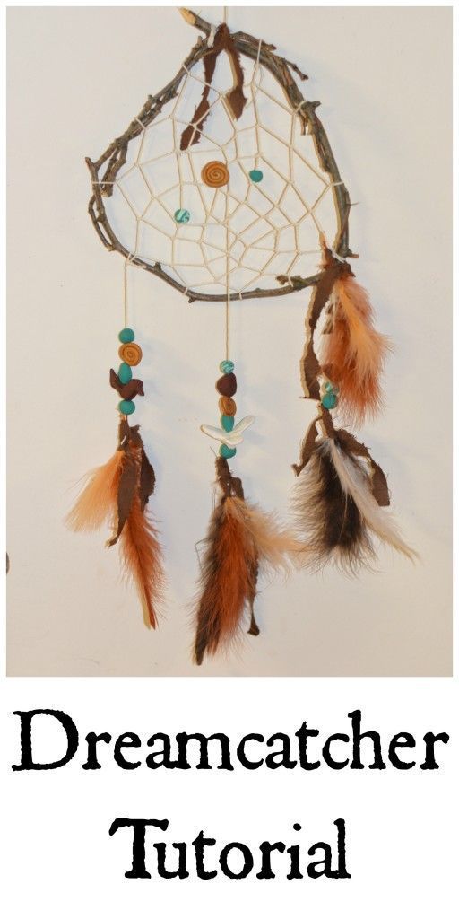 a dream catcher with feathers hanging from it's side and the words dream catcher written below