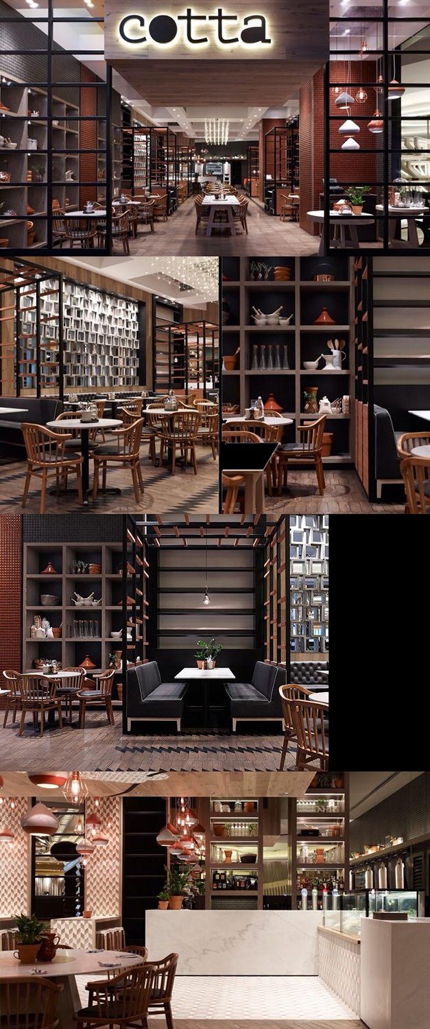 the inside of a restaurant with tables, chairs and shelves filled with food on display