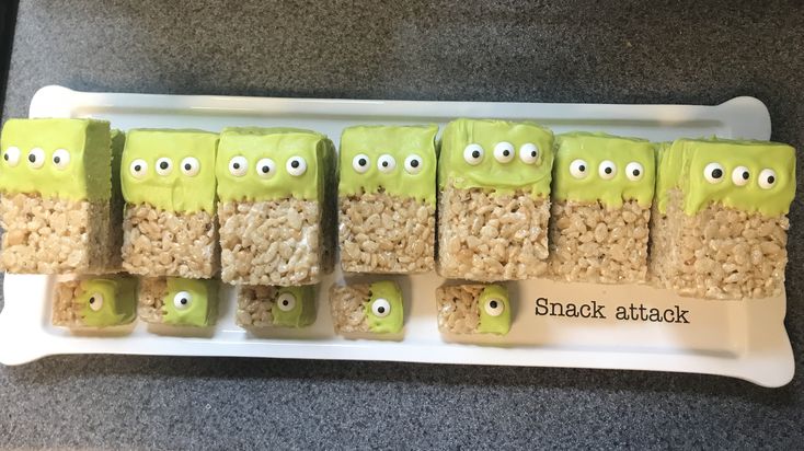 rice krispy treats with green eyes and googly eyes are arranged on a white plate