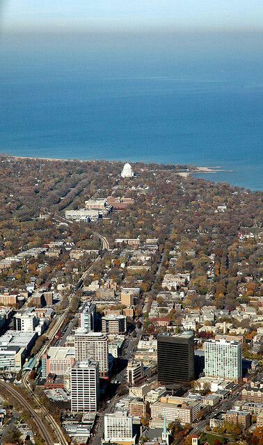 an aerial view of a city with water in the background and buildings on both sides