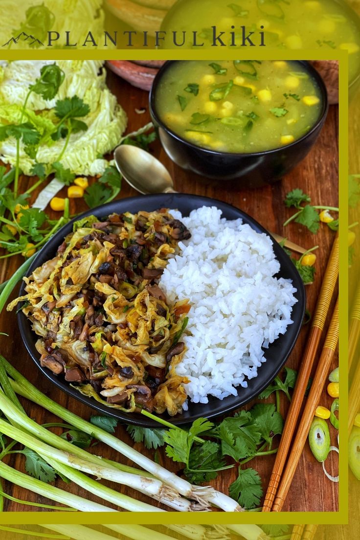 a plate filled with rice and vegetables next to chopsticks on a wooden table