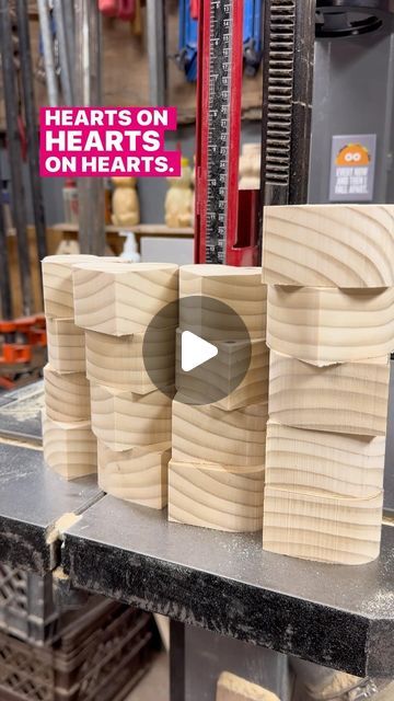 some wooden blocks are stacked on top of each other in a shop with the words hearts on hearts on them