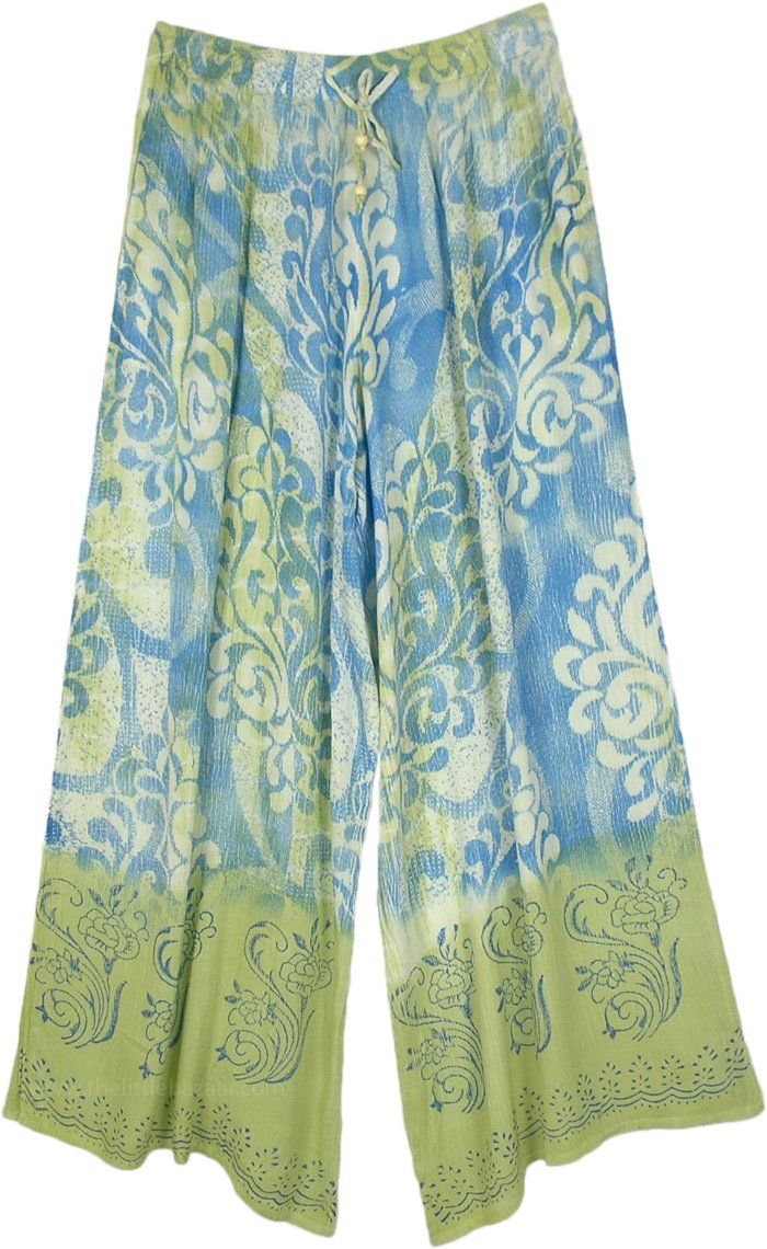 A pair of beach-inspired super comfy wide-leg pants with sea-green and sea-blue tie-dye and floral prints. The prints merge into each other, creating a fascinating look. #tlb #SplitSkirtsPants #beachwrap #Floral #Printed #WideLegPants #BeachPants #CasualPants #HippiePants Printed Wide Leg Pants For Beach In Spring, Spring Beach Printed Wide Leg Pants, Spring Beach Wide Leg Printed Pants, Blue Flowy Floral Print Bottoms, Summer Printed Wide Leg Pants With Relaxed Fit, Blue Floral Print Wide Leg Pants For Summer, Casual Green Printed Wide Leg Pants, Green Printed Beach Pants, Spring Green Printed Wide Leg Pants