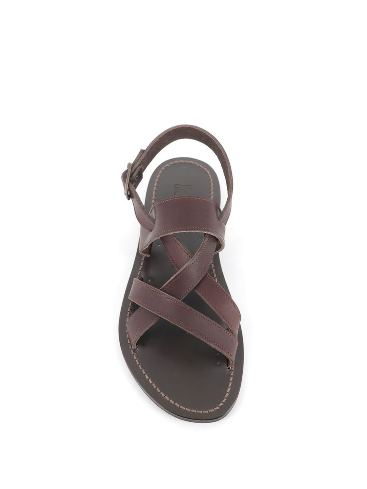 Dark brown leather sandal by K. Jacques, featuring by crossed leather straps. Unlined interior. Leather sole. Heel: 1 cmComposition: Leather Brown Open Toe Sandals With Leather Sole, Brown Leather Slingback Sandals With Leather Footbed, Leather Slingback Sandals With Toe Strap, Classic Brown Leather Slingback Sandals, Brown Leather Open Heel Toe Ring Sandals, Brown Open Toe Slingback Sandals With Leather Sole, Brown Calf Leather Sandals With Leather Footbed, Classic Brown Calf Leather Sandals, Classic Leather Slingback Sandals With Leather Lining