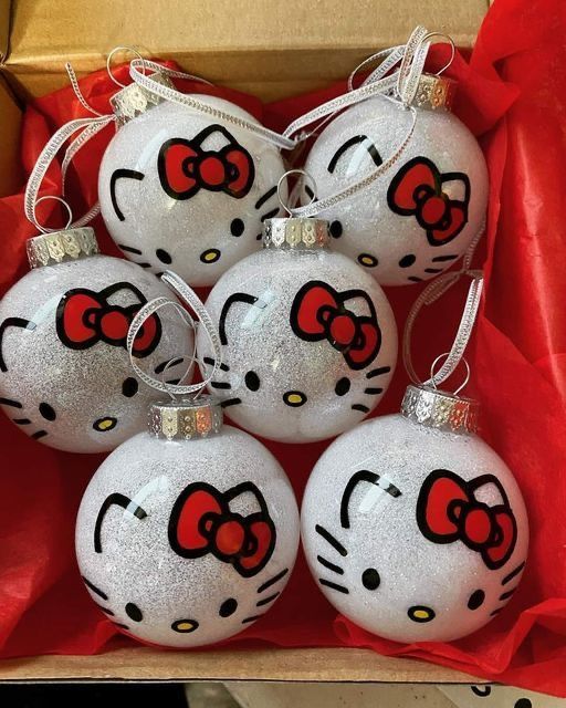 six hello kitty ornaments in a box