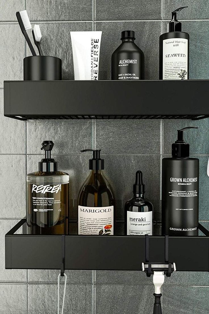 the bathroom shelf is filled with different types of soaps and lotion bottles on it