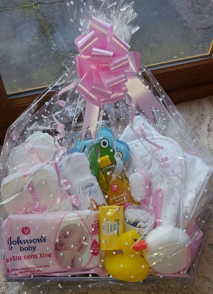 a basket filled with lots of baby items