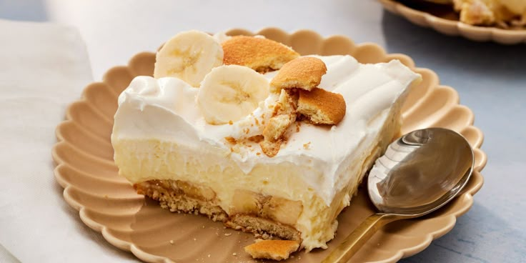 a piece of banana cream pie on a plate with a spoon