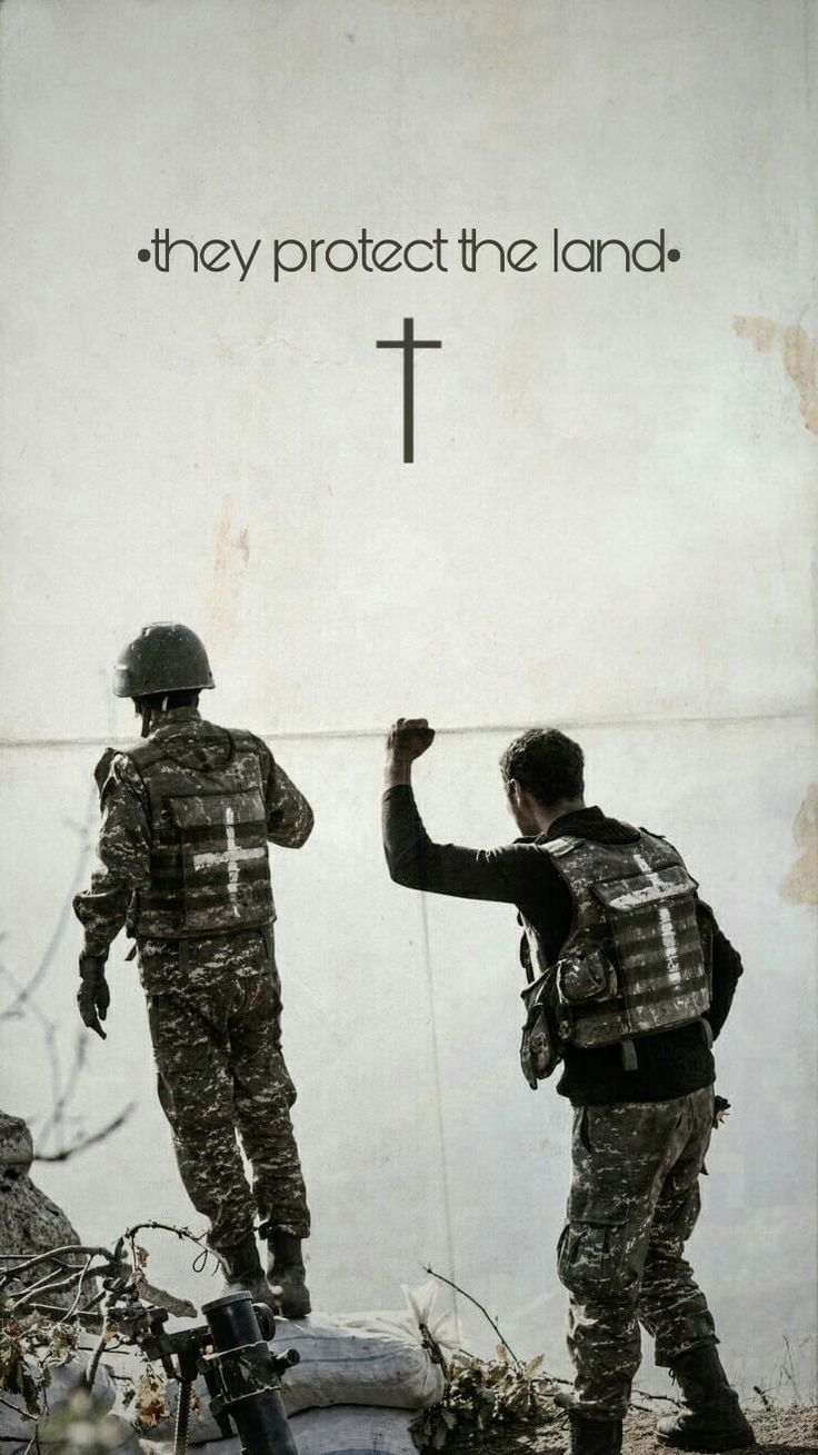 two soldiers standing in front of a cross with the words they protect the land