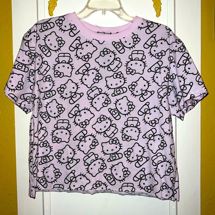 Super Cute Hello Kitty Light Pink T-Shirt Light Pink Cute Tee Quality T-Shirt Cute Design Same Or Next Day Shipping Trendy Cotton T-shirt With Hello Kitty Print, Trendy Top With Cat Print And Crew Neck, Trendy Crew Neck Top With Cat Print, Fun Hello Kitty Short Sleeve Tops, Kawaii Hello Kitty Print Crew Neck Top, Hello Kitty Short Sleeve Tops For Summer, Hello Kitty Crew Neck Fun Tops, Hello Kitty Fun Crew Neck Top, Hello Kitty Print Crew Neck Top For Summer