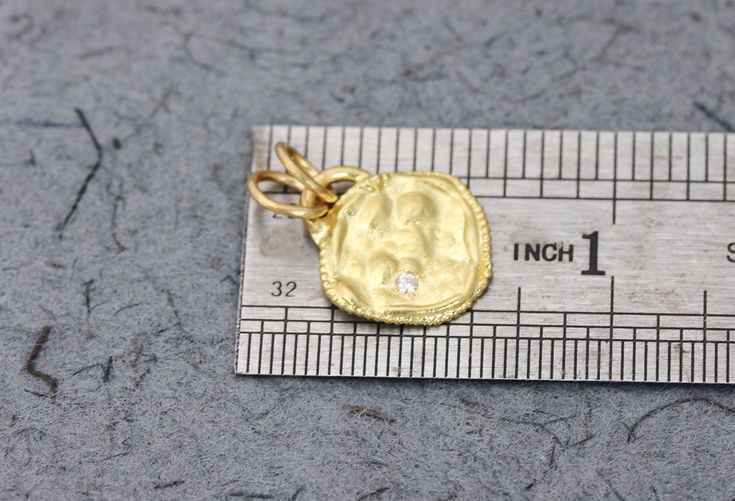 "A solid gold pendant set with a diamond, in 14k or 18k solid yellow, white or rose gold, in a boho antique style design. This solid gold antique-style pendant has a rustic textured and is set with a natural white diamond. The pendant has a gold arc on top, in which there are 2 gold loops, and has a delicate granulation all around it. This pendant is delicate but has a lot of character, and will upgrade any outfit you'll wear. This is a lovely pendant for everyday use, as for special occasions. 22k Gold Jewelry With Single Cut Diamonds, Heirloom Gold Jewelry With Diamond Accents, Hammered Pendant In Fine Jewelry Style, Hammered Yellow Gold Coin Jewelry, Heirloom Gold Jewelry With Single Cut Diamonds, Diamond Coin Pendant Jewelry For Anniversary, 22k Gold Jewelry With Diamond Accents, Elegant Hammered Coin Jewelry, Antique Yellow Gold Jewelry With Hammered Details