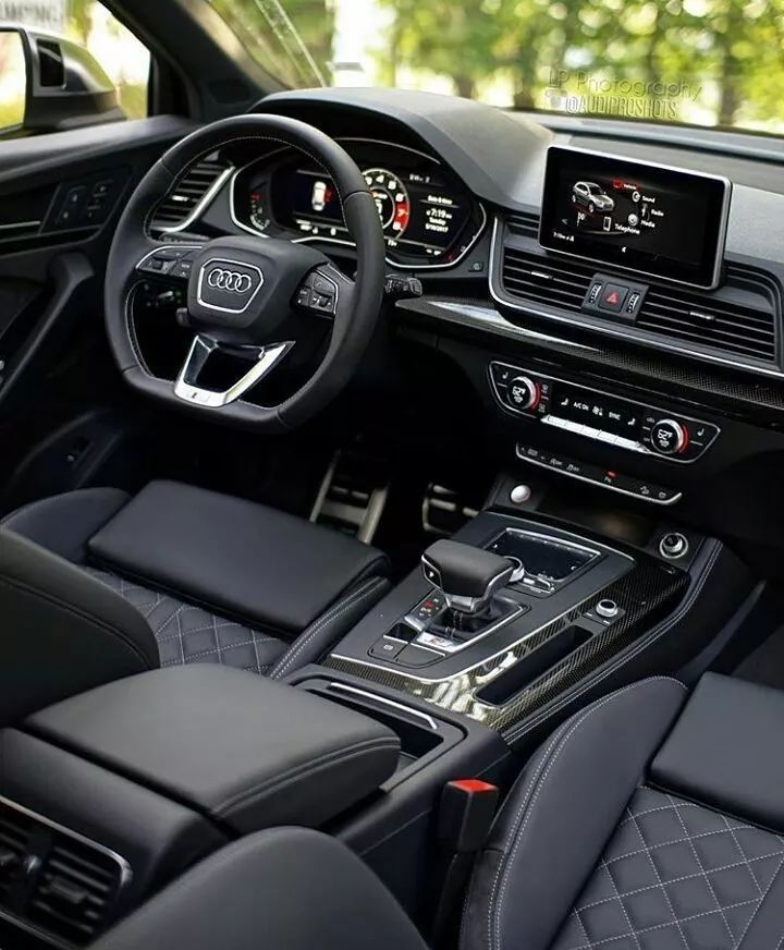 the interior of an audi car with black leather seats and steering wheel, dashboard controls, and dash board