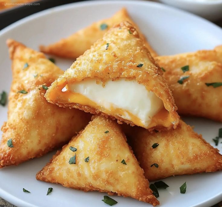 some food is on a white plate with green garnish and parmesan cheese